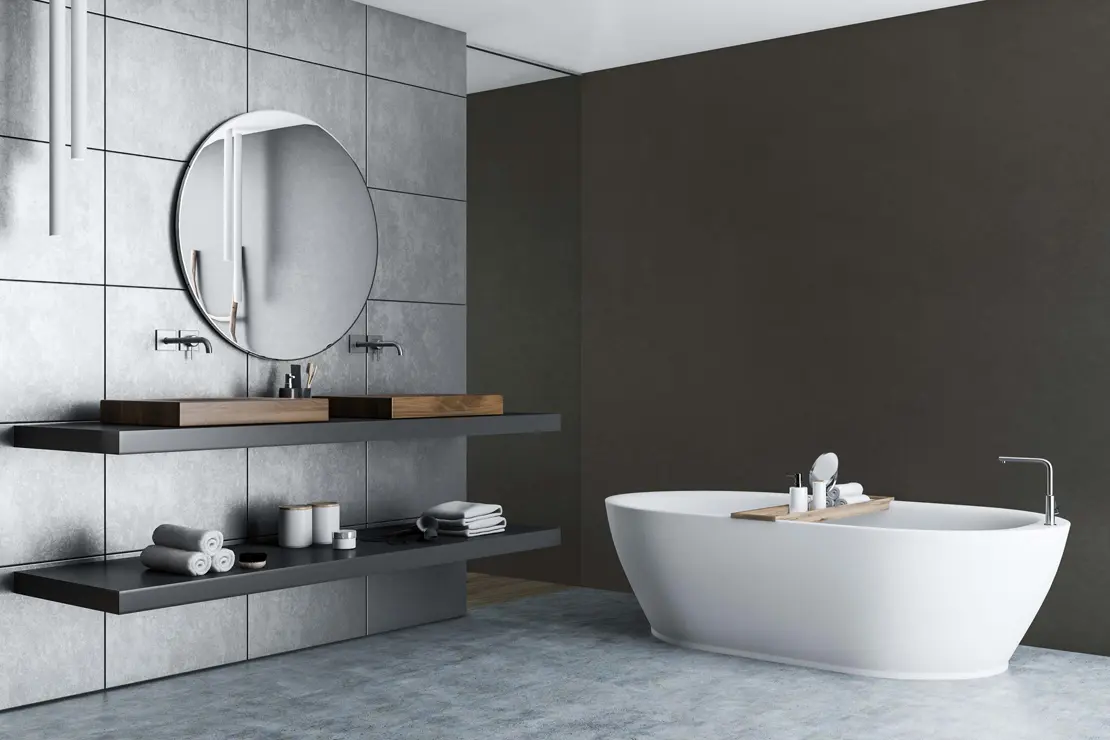 Baño con muros de microcemento de tono gris profundo Baño con muros de microcemento de tono gris profundo
